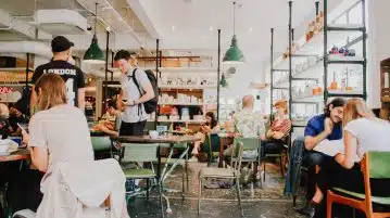 people eating inside of cafeteria during daytime